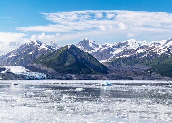A view of snow capped mountains by Hubbard Glacier