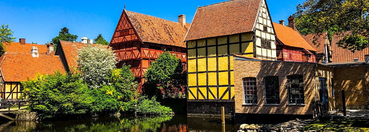 beautiful danish homes are located near a river in aarhus