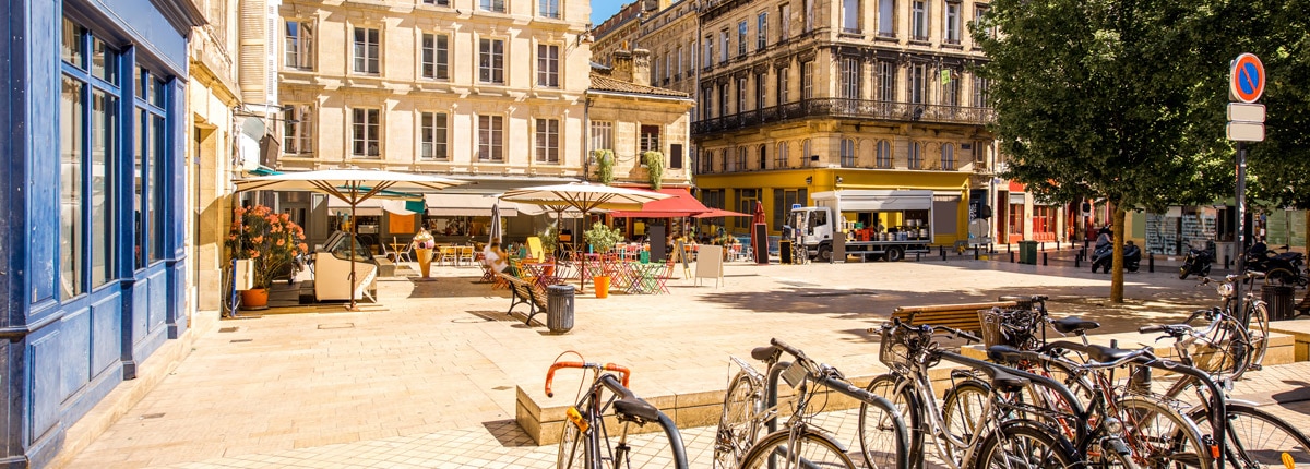 view of the small square with parked bicycles in bordeaux city in france