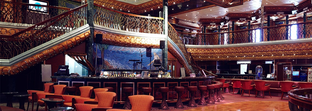 The Atrium Bar has live music and a welcoming vibe onboard a Carnival Cruise.