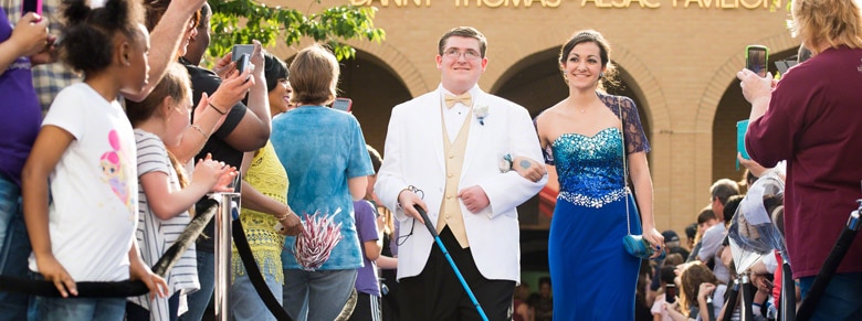 Two kids arriving at st. Jude's spring formal
