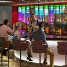 guests enjoying music and cocktails at the mix bar onboard carnival festivale