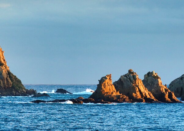 large rock formations in the ocean in miyazaki japan