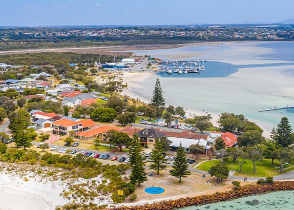 homes are surounded by the ocean located in albany