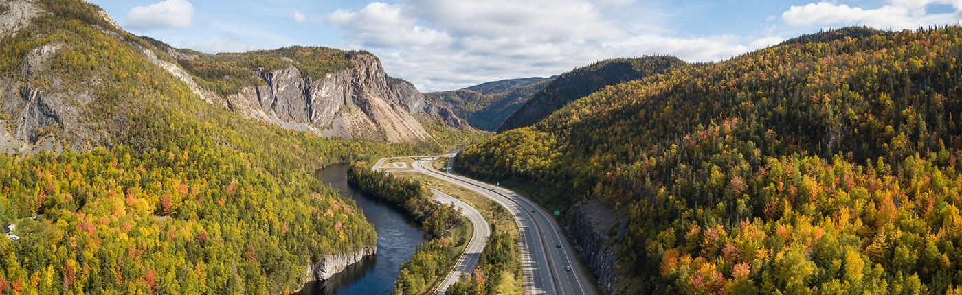 view of a scenic road during a vibrant sunny day near corner brook, newfoundland