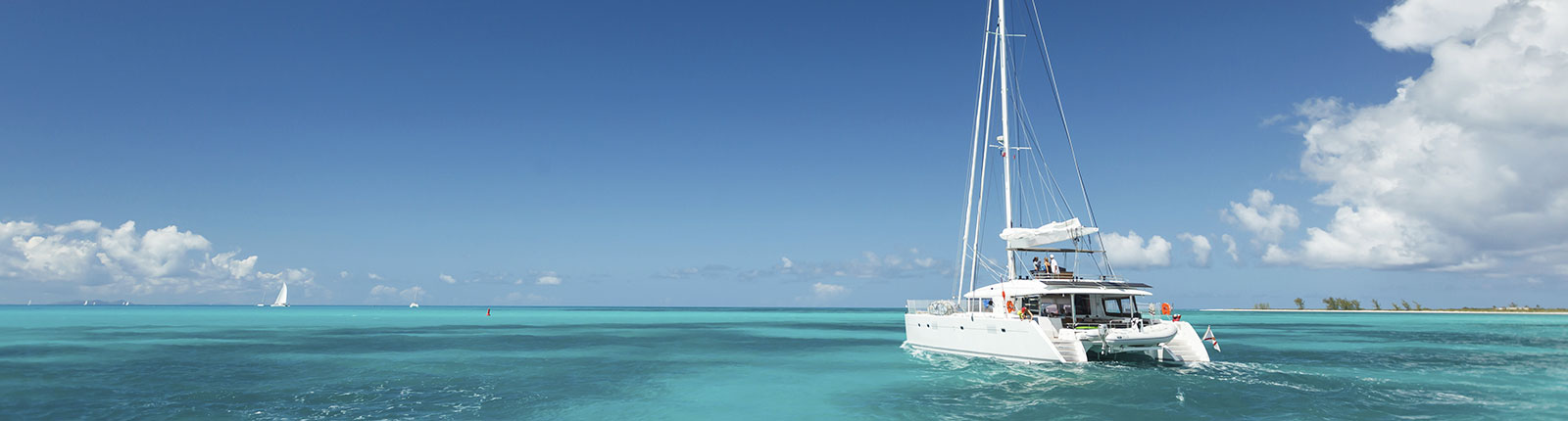 Catamaran sailing in the blue waters alongside Barbados