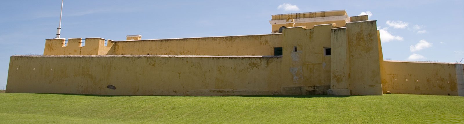 Historic building and manicured lawn under the shining sun in St. Croix