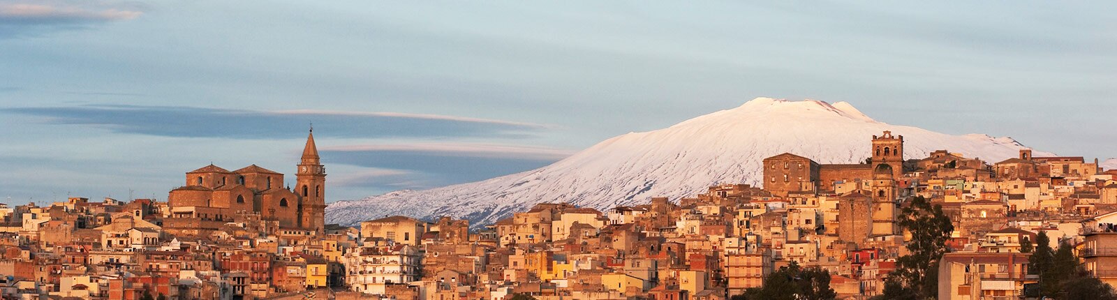 Snow-capped mountain set behind the city in Messina, Italy