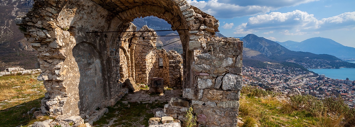 view of ruins and mountains in the background in Bar, Montenegro