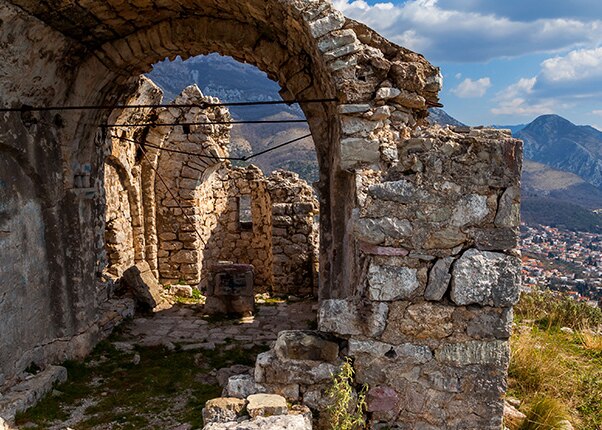 view of ruins and mountains in the background in Bar, Montenegro