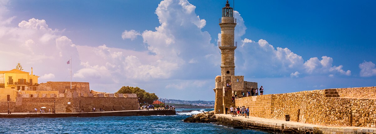 lighthouse in old venetian harbour in chania