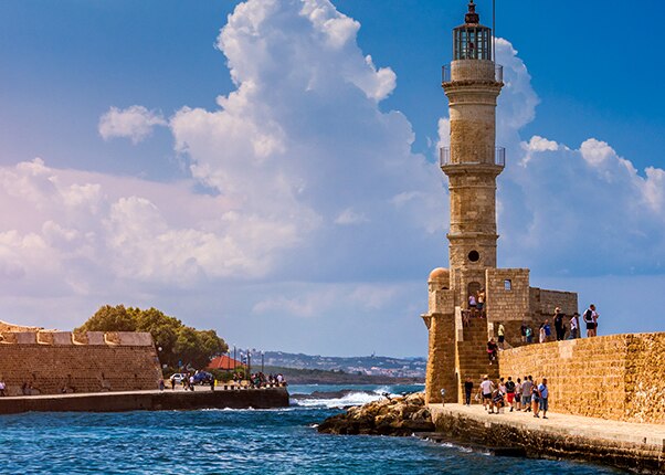 lighthouse in old venetian harbour in chania