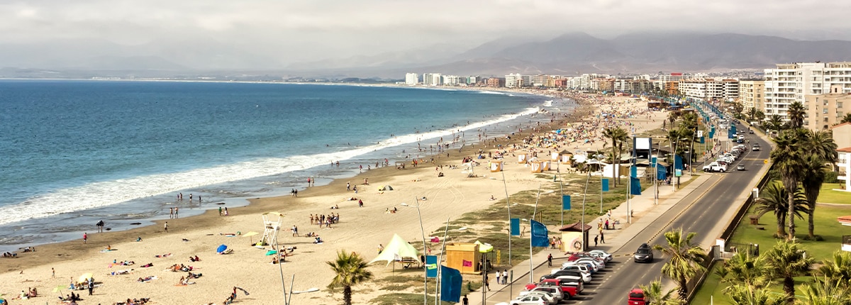 the tropical beach at la serena with mountains in the background