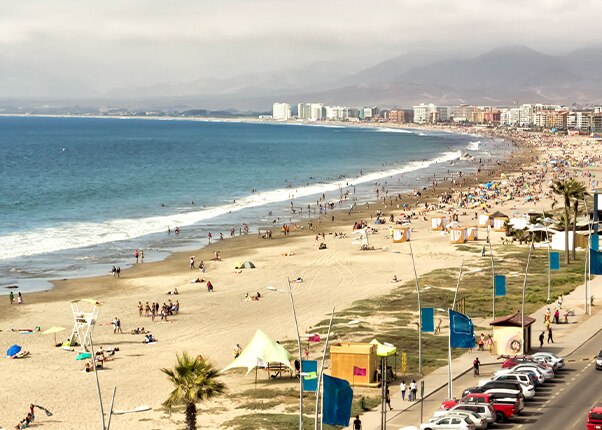 the tropical beach at la serena with mountains in the background