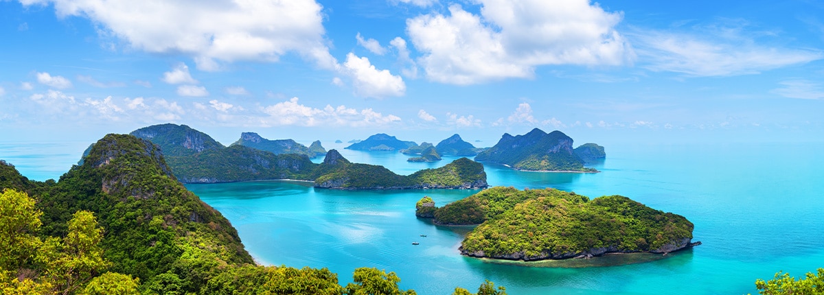 oceans weave around lush green islands located in koh samui