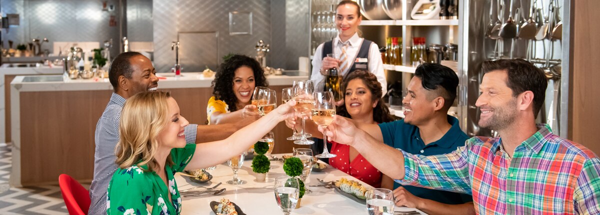 guests having a toast at the carnival kitchen dining table