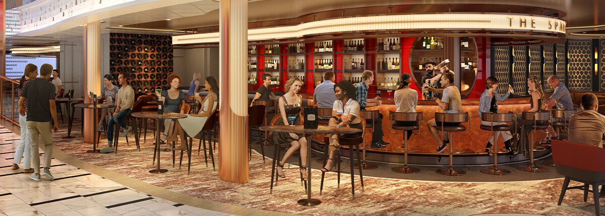 guests enjoys drinks while sitting at the spark bar onboard carnival festivale