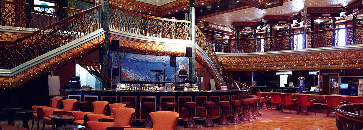 The Atrium Bar has live music and a welcoming vibe onboard a Carnival Cruise.