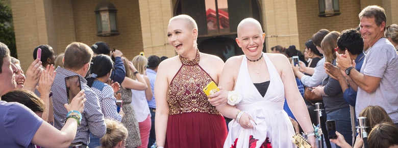 two women arriving at St. Judes spring formal