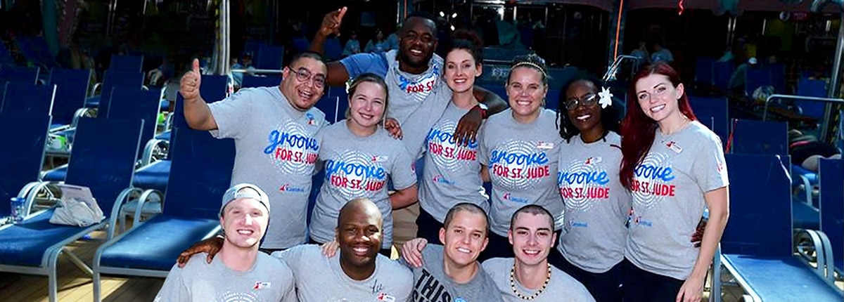 a group of people smiling for the camera wearing the st jude children's research hospital grey shirts