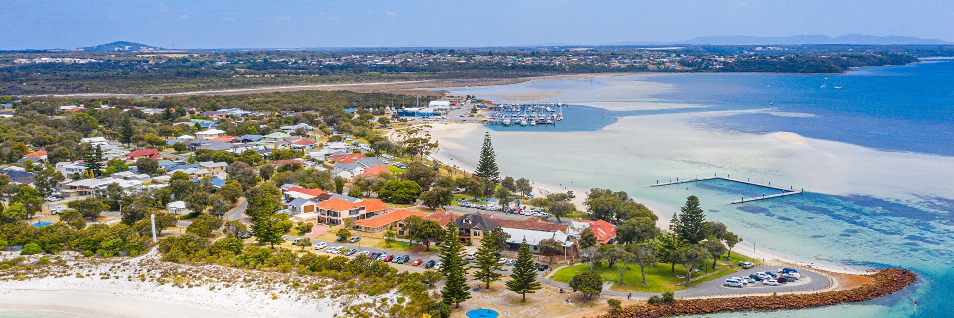 homes are surounded by the ocean located in albany