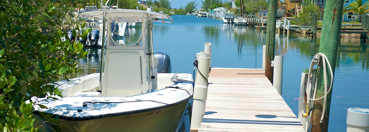 a boat docked on a pier in bimini
