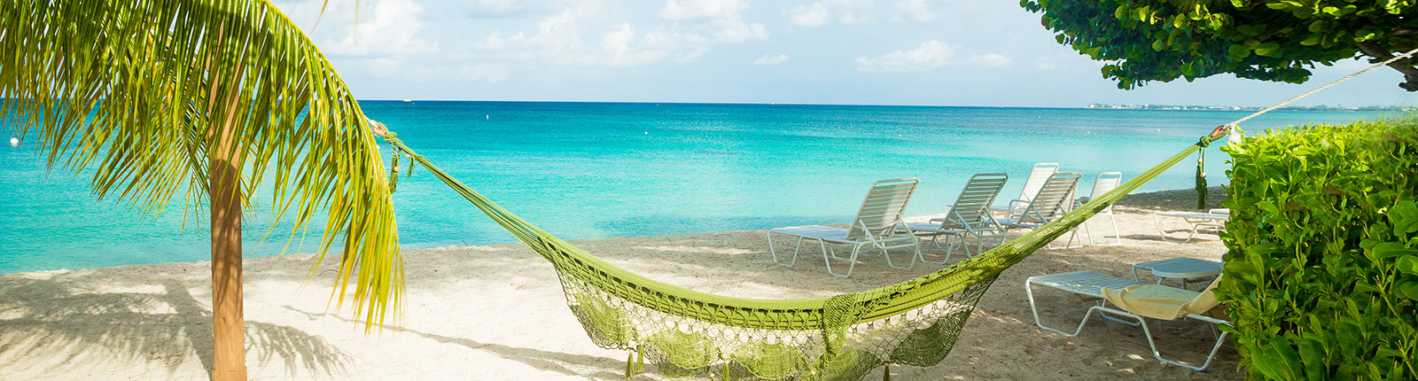 A grand hammock on a peaceful beach in Grand Cayman
