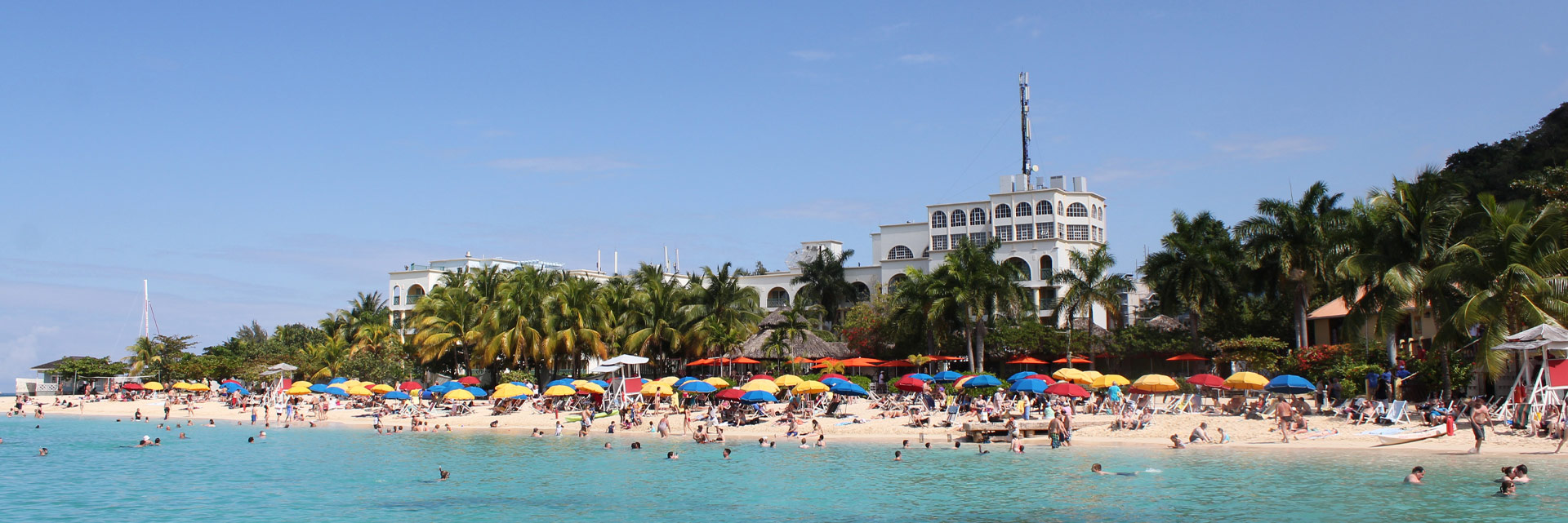 Gorgeous flowers frame the Rose Hall Great House in Montego Bay, Jamaica