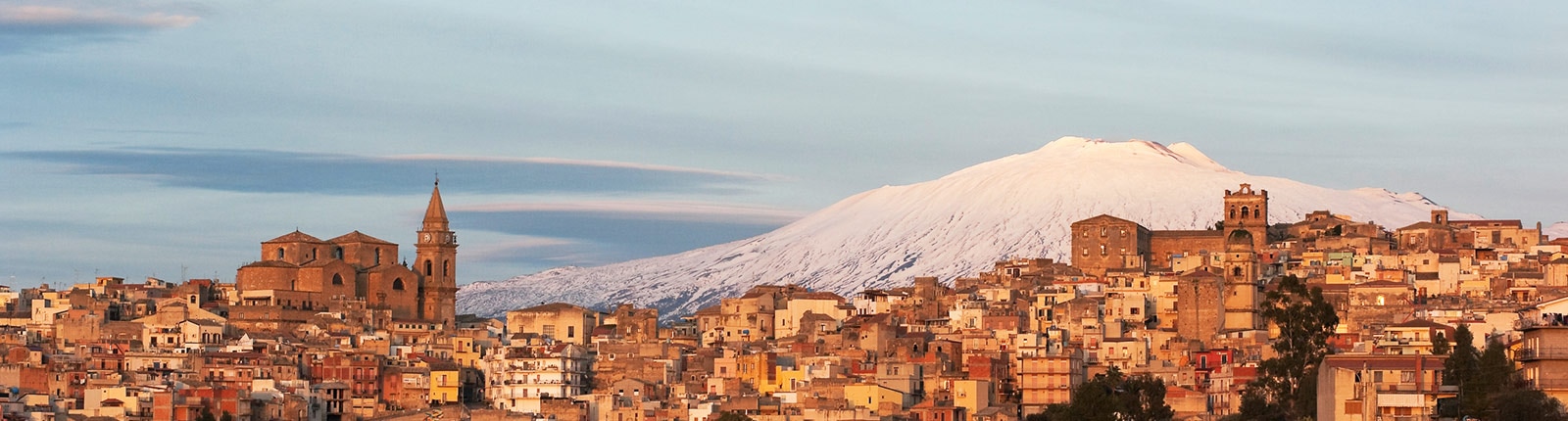 Snow-capped mountain set behind the city in Messina, Italy