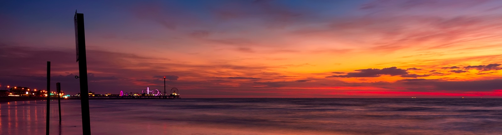 Colorful sunset along the coastline in Galveston, TX