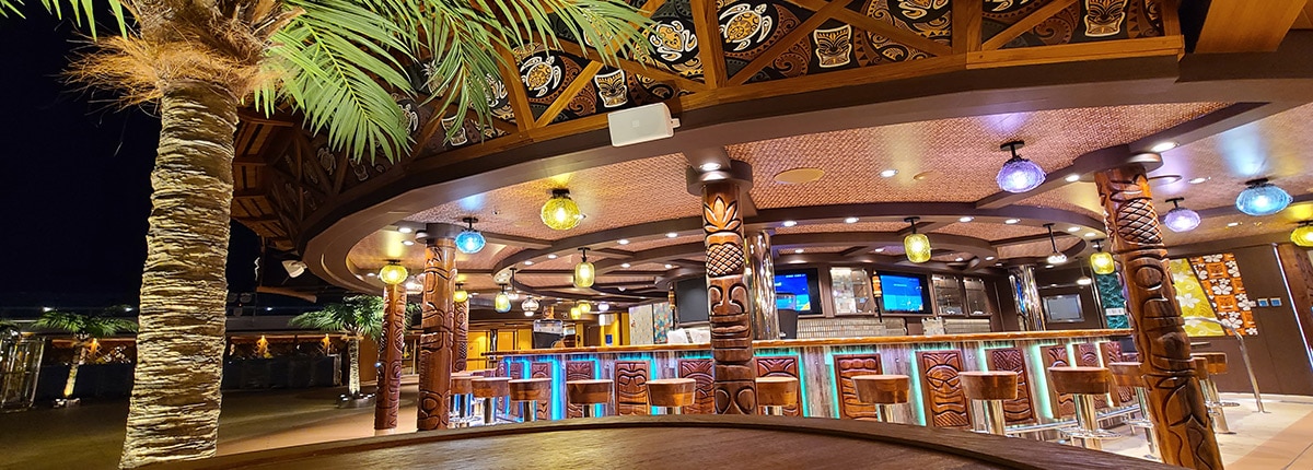 wood carvings on the red frog tiki bar onboard mardi gras