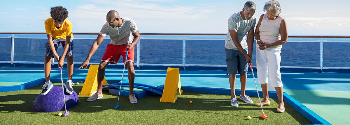 guests playing a game of mini golf onboard the carnival horizon