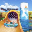 family sliding down a raft waterslide onboard carnival festivale