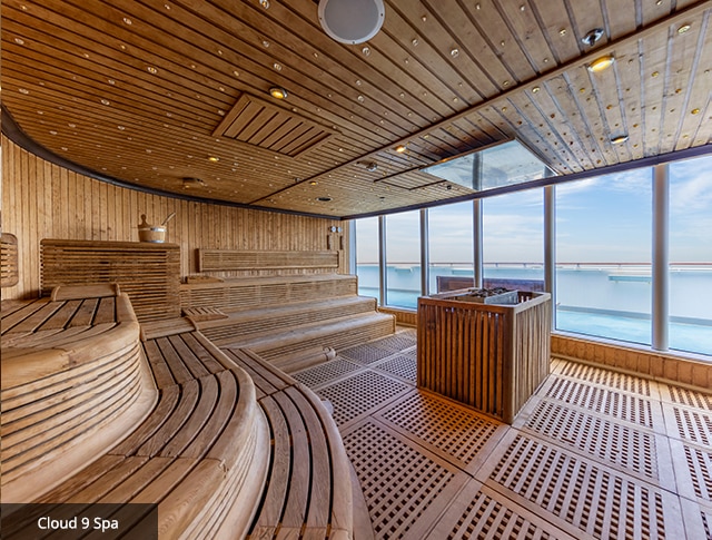 large sauna within the cloud 9 spa with floor-to-ceiling windows overlooking the sea