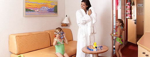 mother brushing her hair and daughter exiting the bathroom